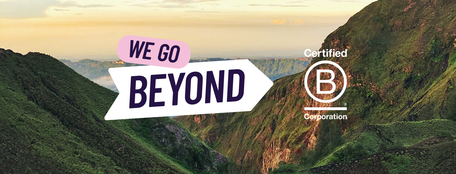 B-corp-logo-with-we-go-beyond-slogan-over-mountainous-background